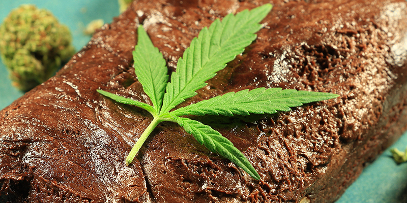 a cannabis leaf on top of a brownie